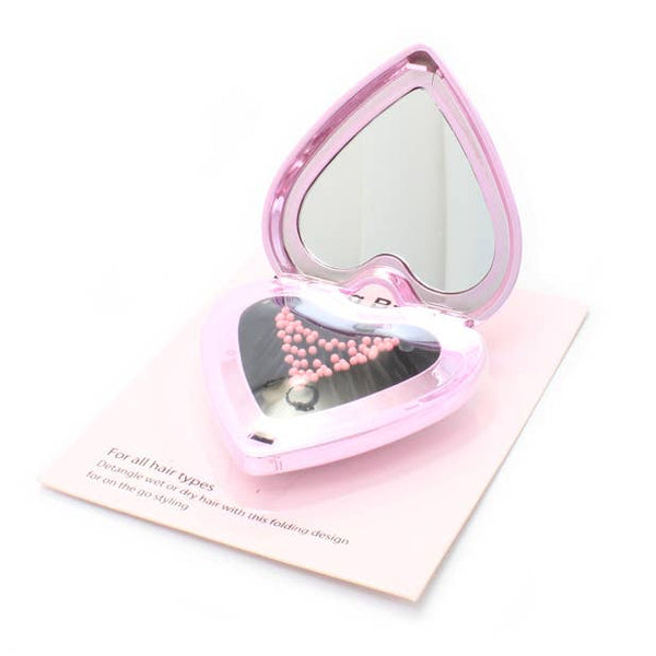 Folding heart shaped detangling brush