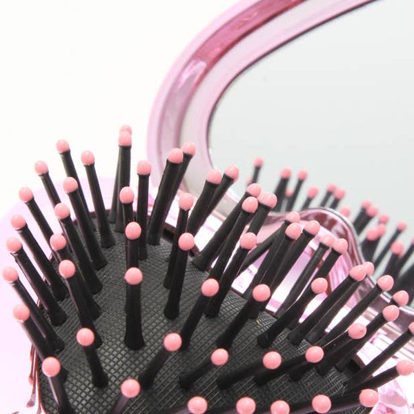 Folding heart shaped detangling brush